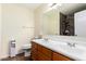 This bathroom includes a vanity with double sinks and a full mirror at 937 N Marble St, Gilbert, AZ 85234