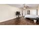 This is a bedroom with hardwood floors and a ceiling fan at 937 N Marble St, Gilbert, AZ 85234