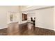 Inviting living space with hardwood floors, large window, and a built-in bookcase at 937 N Marble St, Gilbert, AZ 85234