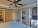 Bedroom with a barn door leading to a bathroom, views of the living room, and soft blue color tones at 9450 E Becker Ln # 2099, Scottsdale, AZ 85260