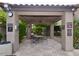 Outdoor common area with covered seating, providing a relaxing space for residents at 9450 E Becker Ln # 2099, Scottsdale, AZ 85260