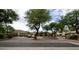 View of the Aventura Condominium community with mature landscaping and inviting entryways at 9450 E Becker Ln # 2099, Scottsdale, AZ 85260