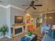 Comfortable living room with a cozy fireplace, modern decor, and an orange accent chair at 9450 E Becker Ln # 2099, Scottsdale, AZ 85260