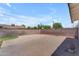 Spacious backyard featuring concrete patio and partial brick wall, perfect for entertaining at 1020 E Concorda Dr, Tempe, AZ 85282