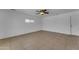 Spacious bedroom featuring a ceiling fan, neutral paint and tile flooring and one window at 1020 E Concorda Dr, Tempe, AZ 85282