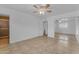 Bedroom with tile flooring, ceiling fan, and sliding door closet, connected to ensuite bathroom at 1020 E Concorda Dr, Tempe, AZ 85282