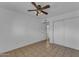 Bedroom with ceiling fan, doorway, and closet at 1020 E Concorda Dr, Tempe, AZ 85282