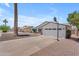 A single-story home features a driveway, garage, basketball hoop and landscaping at 1020 E Concorda Dr, Tempe, AZ 85282