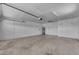 Spacious garage with ample storage cabinets, water heater, and automatic door opener at 1020 E Concorda Dr, Tempe, AZ 85282
