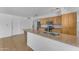 Updated kitchen with a breakfast bar, wooden cabinets, and stainless steel appliances at 1020 E Concorda Dr, Tempe, AZ 85282