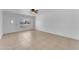 A brightly lit living room features neutral tile floors and a white door at 1020 E Concorda Dr, Tempe, AZ 85282