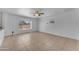 Spacious living room with tile flooring, ceiling fan, and plenty of natural light from the window at 1020 E Concorda Dr, Tempe, AZ 85282