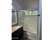 Bathroom vanity featuring sink, granite counters and shower with glass doors at 1040 W Juniper Ave, Gilbert, AZ 85233