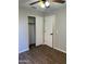 Bedroom with wood-look floors, ceiling fan and closet at 1040 W Juniper Ave, Gilbert, AZ 85233