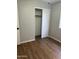 Bedroom with wood-look floors, and closet at 1040 W Juniper Ave, Gilbert, AZ 85233