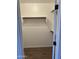 A closet with wood-slat shelving and wood-look flooring at 1040 W Juniper Ave, Gilbert, AZ 85233