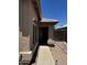 Pathway leading to the front door, featuring desert-style landscaping and a security screen door at 1040 W Juniper Ave, Gilbert, AZ 85233