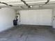 Clean and spacious two-car garage interior with water heater and room for vehicles at 1040 W Juniper Ave, Gilbert, AZ 85233
