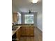 Kitchen featuring granite countertops, a breakfast bar, and ample natural light at 1040 W Juniper Ave, Gilbert, AZ 85233