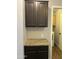 A laundry area featuring upper cabinets and granite countertop at 1040 W Juniper Ave, Gilbert, AZ 85233