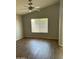 Living room with vaulted ceilings, fan, and window providing light at 1040 W Juniper Ave, Gilbert, AZ 85233