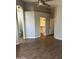 Large main bedroom with wood-look floors, with access to a closet and an ensuite bathroom at 1040 W Juniper Ave, Gilbert, AZ 85233