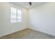 Bedroom with neutral carpet and a window at 10609 E Durant Dr, Mesa, AZ 85212