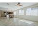 Bright living area with tile floors, multiple windows, and an open layout connecting to the kitchen at 10609 E Durant Dr, Mesa, AZ 85212