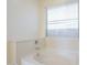 Close-up of a soaking tub with neutral finishes and hardware at 10609 E Durant Dr, Mesa, AZ 85212
