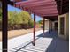 Spacious covered patio overlooks the desert landscaped backyard with mature trees at 1156 E Vinedo Ln, Tempe, AZ 85284