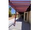 Covered patio offers shade with views of the desert landscaped backyard at 1156 E Vinedo Ln, Tempe, AZ 85284