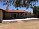 Large backyard with covered patio, desert landscaping, and room for entertaining at 1156 E Vinedo Ln, Tempe, AZ 85284