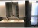 Modern bathroom with dual sinks and a glass-enclosed shower at 1156 E Vinedo Ln, Tempe, AZ 85284