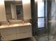 Modern bathroom with dual sinks and a glass-enclosed shower at 1156 E Vinedo Ln, Tempe, AZ 85284