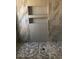Modern shower with gray tile, glass enclosure, and built-in shelves at 1156 E Vinedo Ln, Tempe, AZ 85284