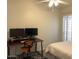 Bedroom featuring desk, computer monitors, area rug, and ceiling fan at 1156 E Vinedo Ln, Tempe, AZ 85284