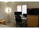 Bedroom featuring desk, two computer monitors, and a dresser at 1156 E Vinedo Ln, Tempe, AZ 85284