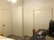 Bedroom featuring closet, desk, computer monitor, and area rug at 1156 E Vinedo Ln, Tempe, AZ 85284