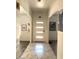 Stylish entryway with modern lighting and marble-patterned tile flooring at 1156 E Vinedo Ln, Tempe, AZ 85284