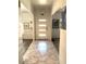 Stylish entryway with modern lighting and marble-patterned tile flooring at 1156 E Vinedo Ln, Tempe, AZ 85284