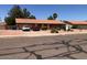 Well-maintained home with desert landscaping, ample parking, and a welcoming facade at 1156 E Vinedo Ln, Tempe, AZ 85284