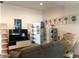 Cozy living room with decor and a tan colored sofa, shelves, and a massage chair at 1156 E Vinedo Ln, Tempe, AZ 85284