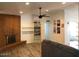 Cozy living room boasting a rustic brick fireplace and modern decor accents at 1156 E Vinedo Ln, Tempe, AZ 85284