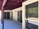 Covered patio with access to the backyard and multiple entry points to the home at 1156 E Vinedo Ln, Tempe, AZ 85284