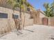 Low maintenance backyard with desert landscaping, stucco walls and secure fencing at 13064 N 100Th Pl, Scottsdale, AZ 85260