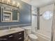 Stylish bathroom with dark vanity and decorative mosaic tile accents at 13064 N 100Th Pl, Scottsdale, AZ 85260