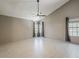Bright, open bedroom with vaulted ceilings, a ceiling fan, and two windows with curtains at 13064 N 100Th Pl, Scottsdale, AZ 85260