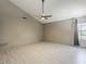 Bedroom with hardwood flooring, vaulted ceilings, ceiling fan, and large window at 13064 N 100Th Pl, Scottsdale, AZ 85260