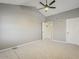 Large, airy bedroom with neutral carpet and access to ensuite bathroom at 13064 N 100Th Pl, Scottsdale, AZ 85260