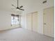 Spacious bedroom with ceiling fan and closet doors at 13064 N 100Th Pl, Scottsdale, AZ 85260